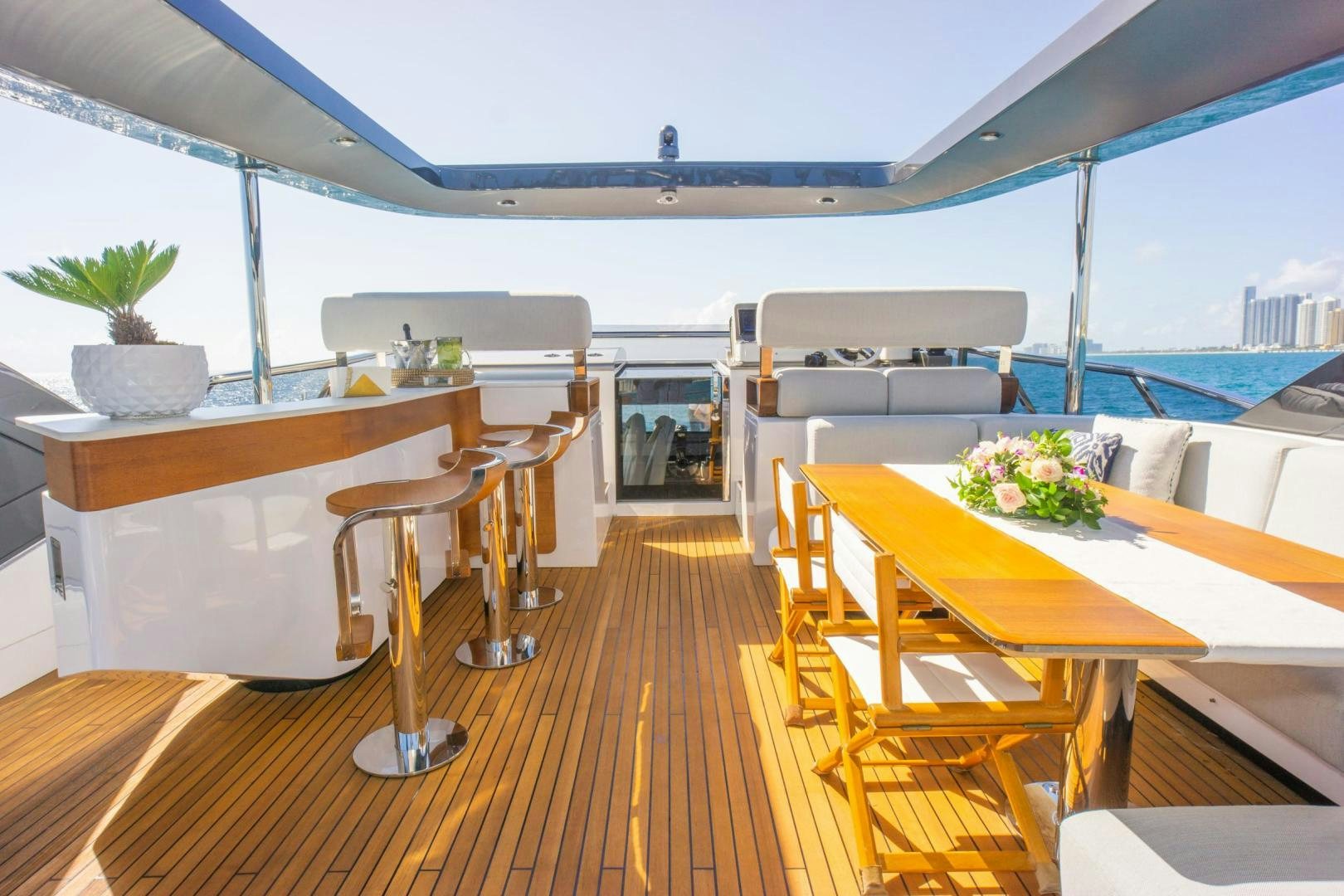 a room with a table and chairs aboard RINA Yacht for Sale