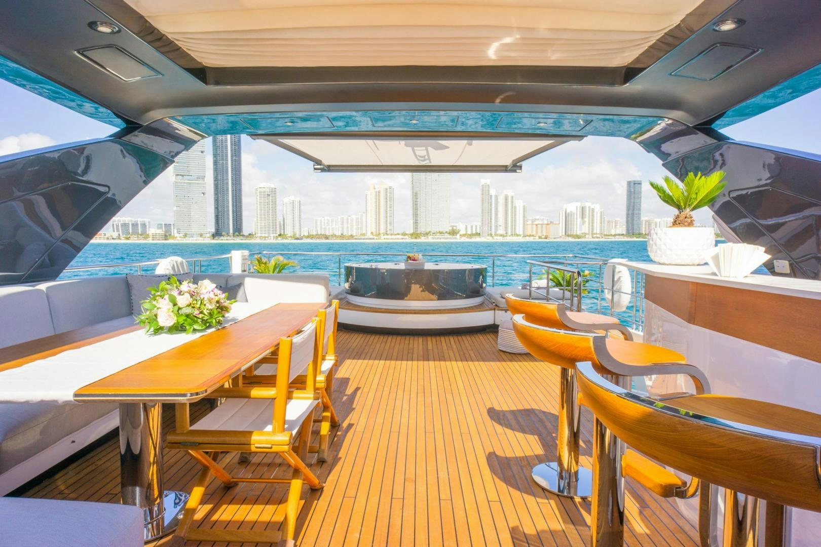 a room with tables and chairs aboard RINA Yacht for Sale