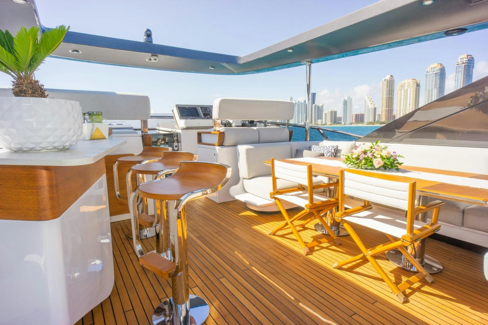 a room with tables and chairs aboard RINA Yacht for Sale
