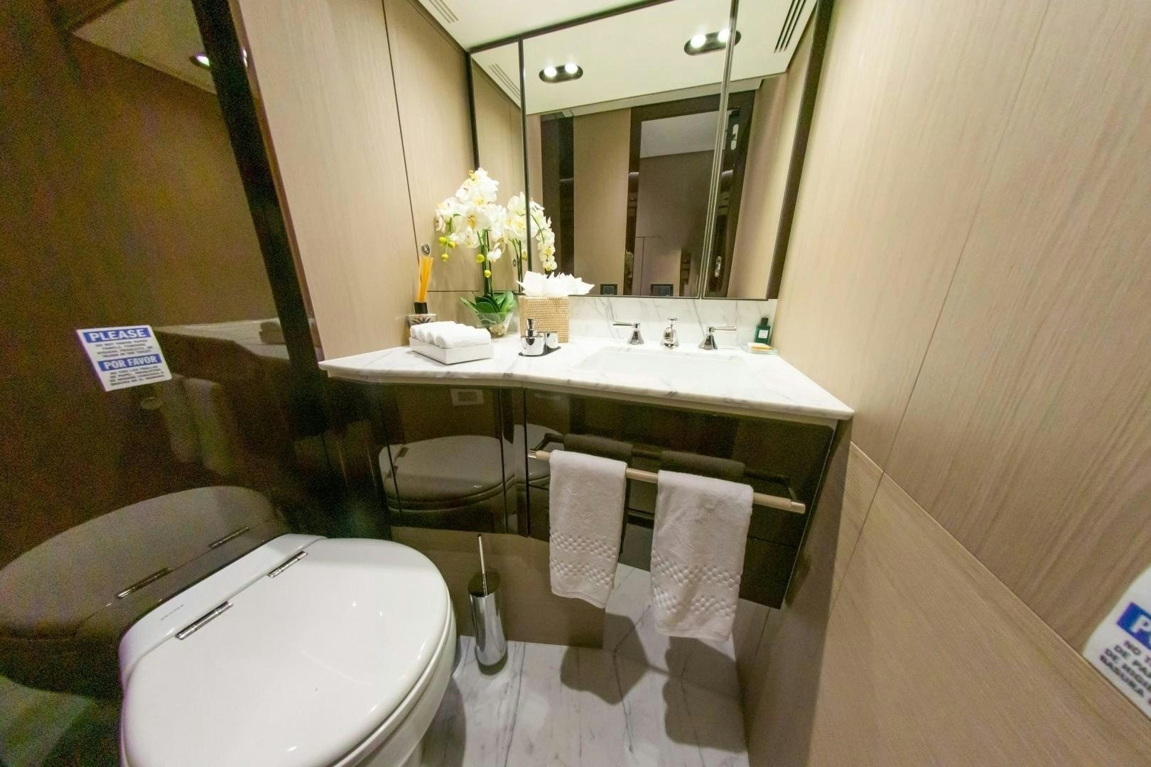 a bathroom with a sink and toilet aboard RINA Yacht for Sale
