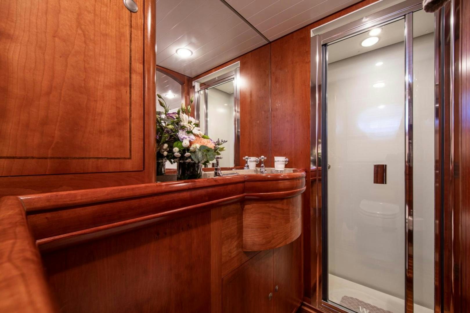 a bathroom with a large mirror aboard WAVELENGTH Yacht for Sale