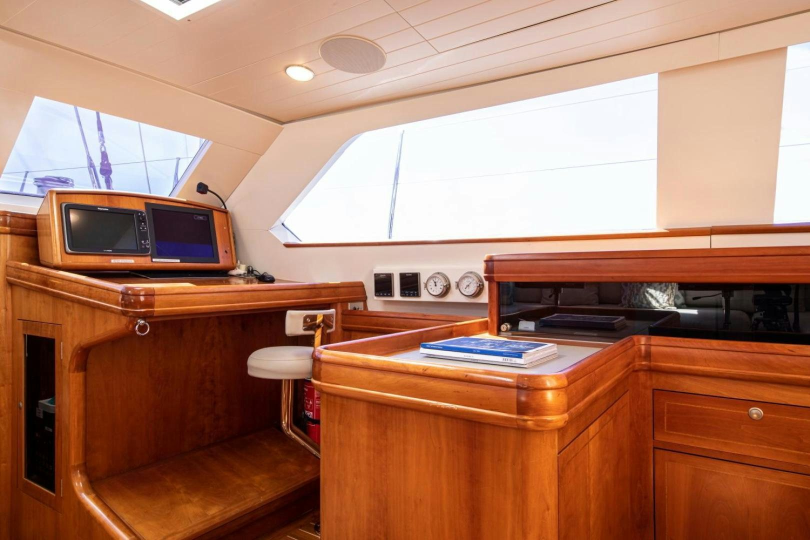 a room with a desk and a television aboard WAVELENGTH Yacht for Sale