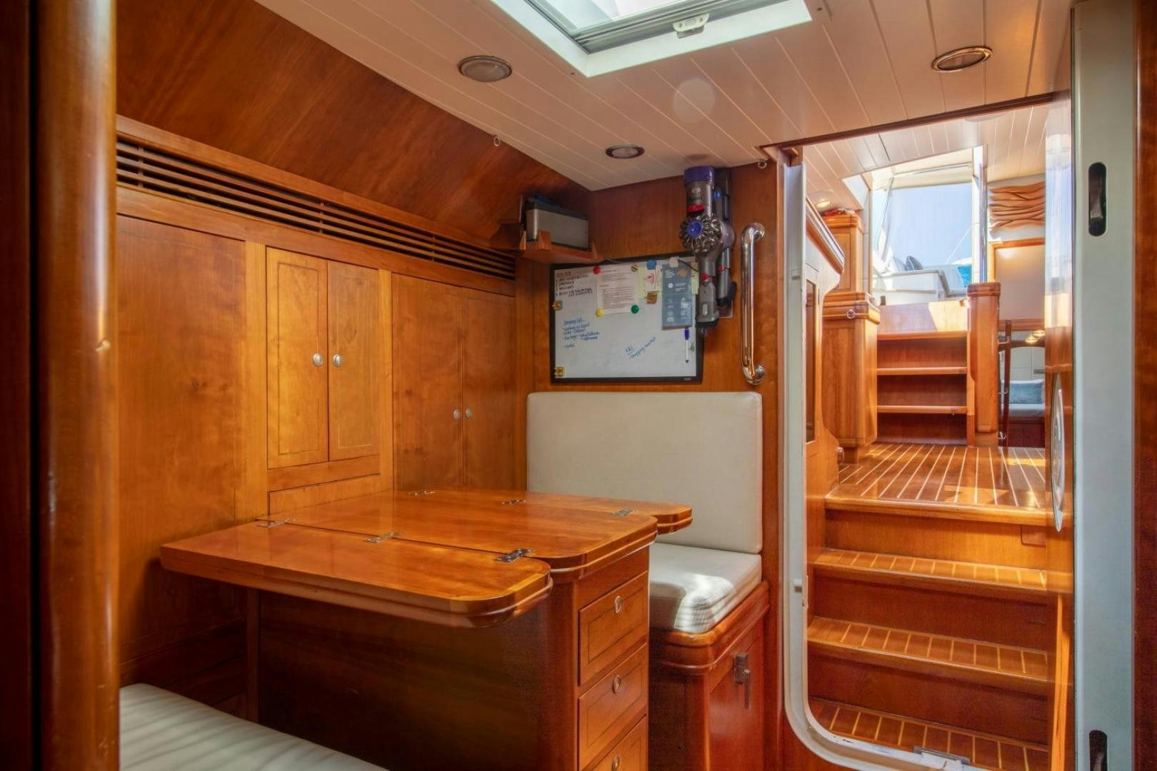 a wooden cabin with a desk aboard WAVELENGTH Yacht for Sale