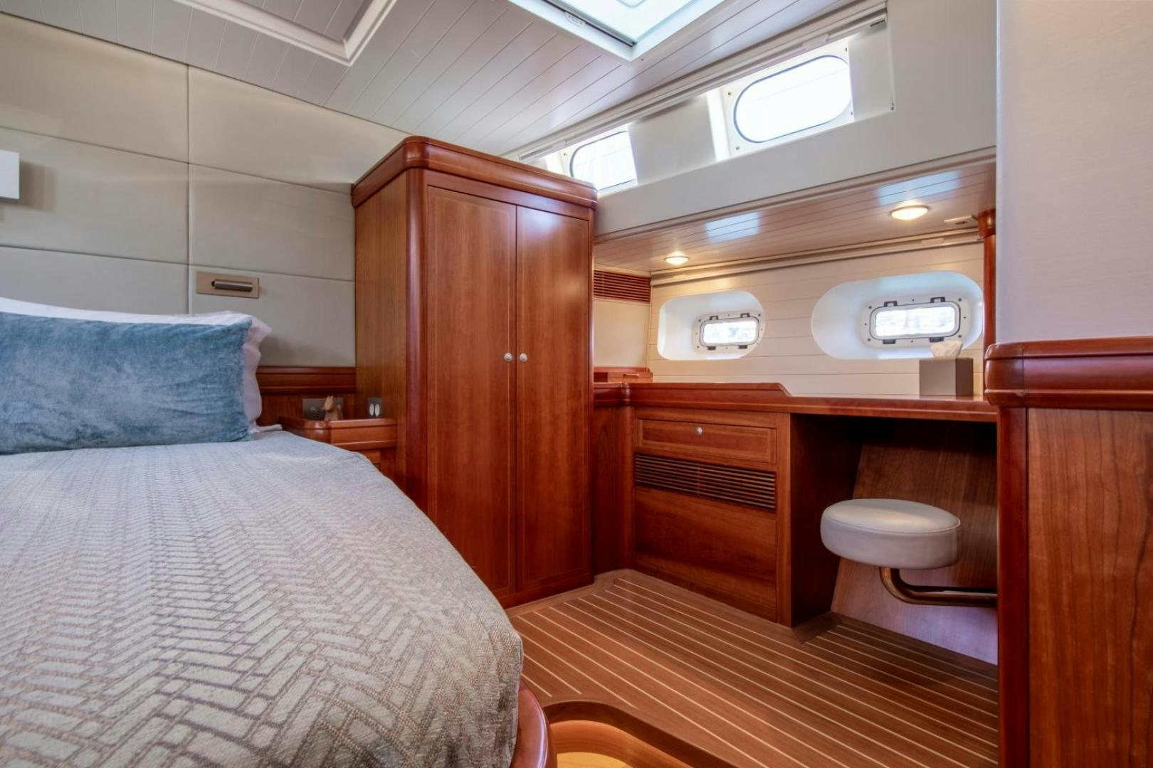 a small bedroom with a bed aboard WAVELENGTH Yacht for Sale