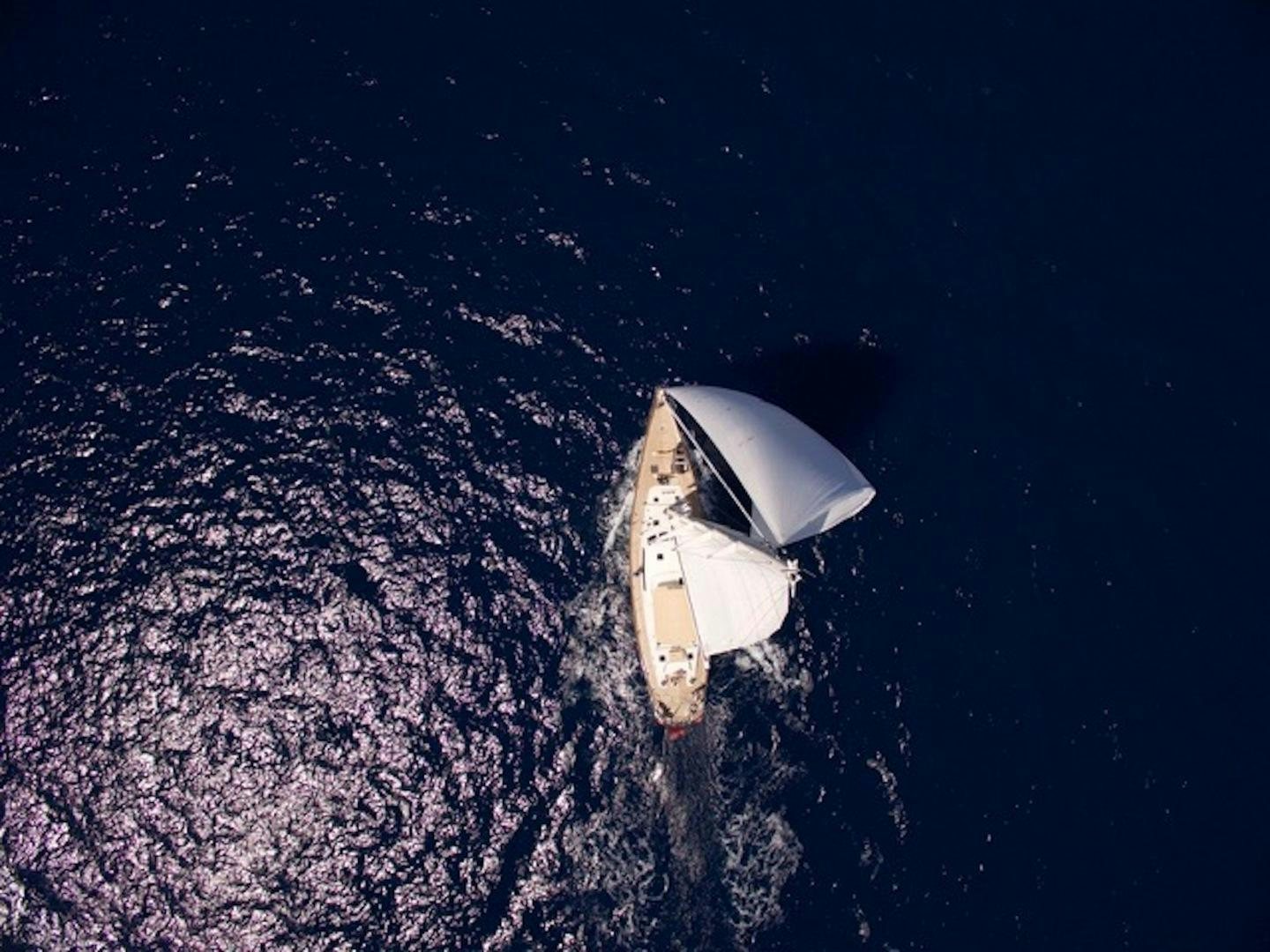a white car on a road aboard WAVELENGTH Yacht for Sale