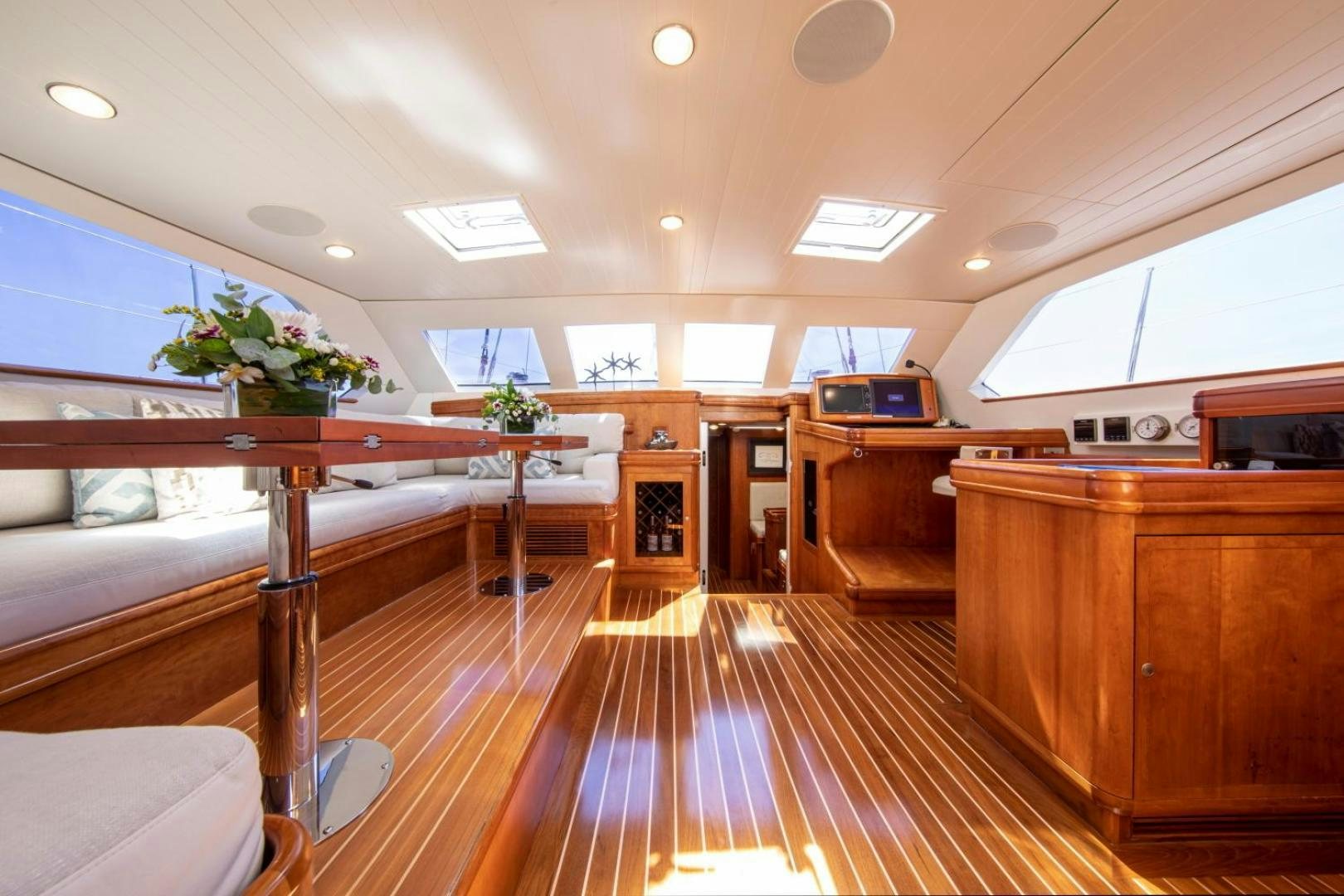 a large room with wooden floors aboard WAVELENGTH Yacht for Sale
