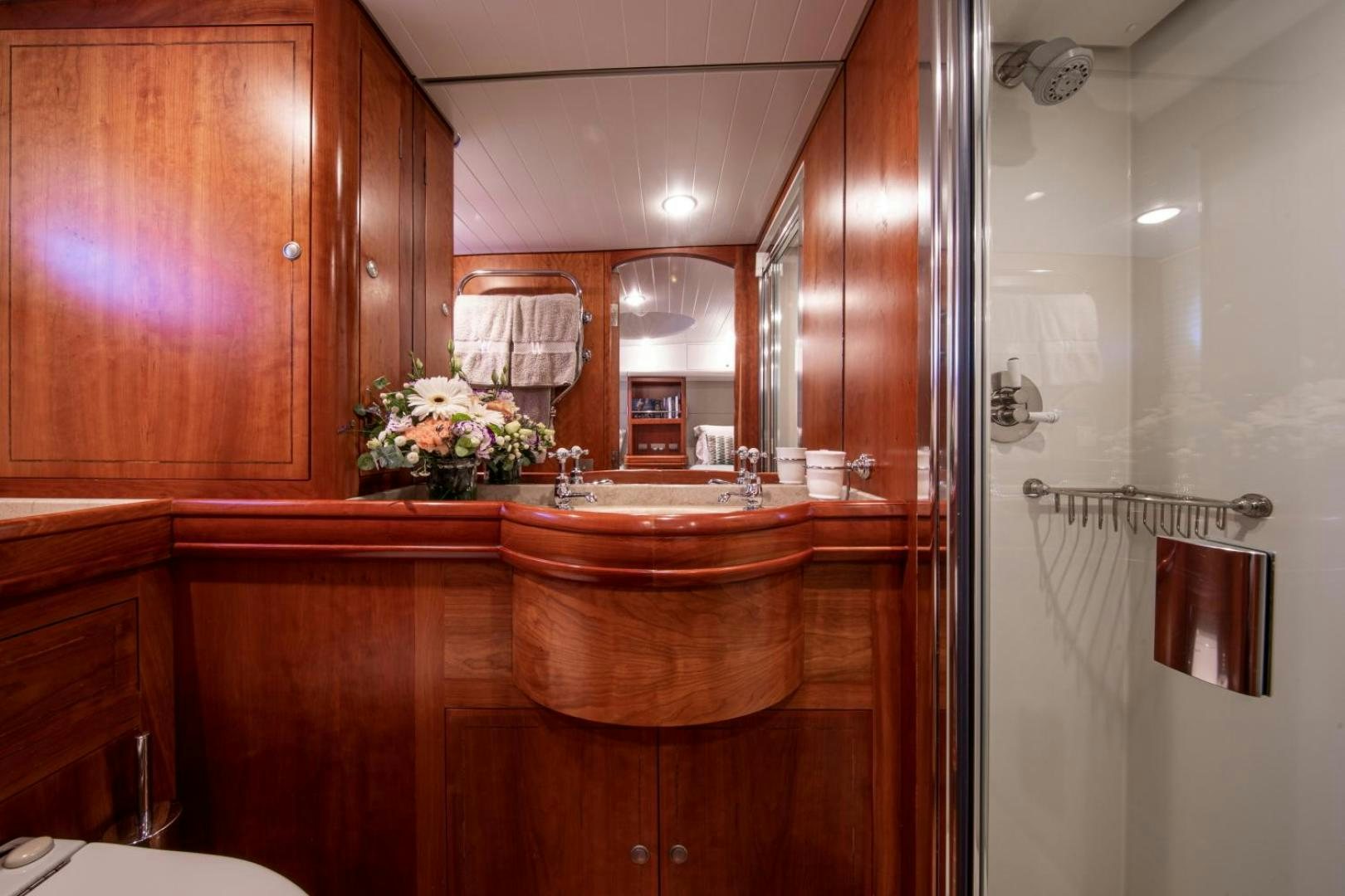 a bathroom with a large mirror aboard WAVELENGTH Yacht for Sale