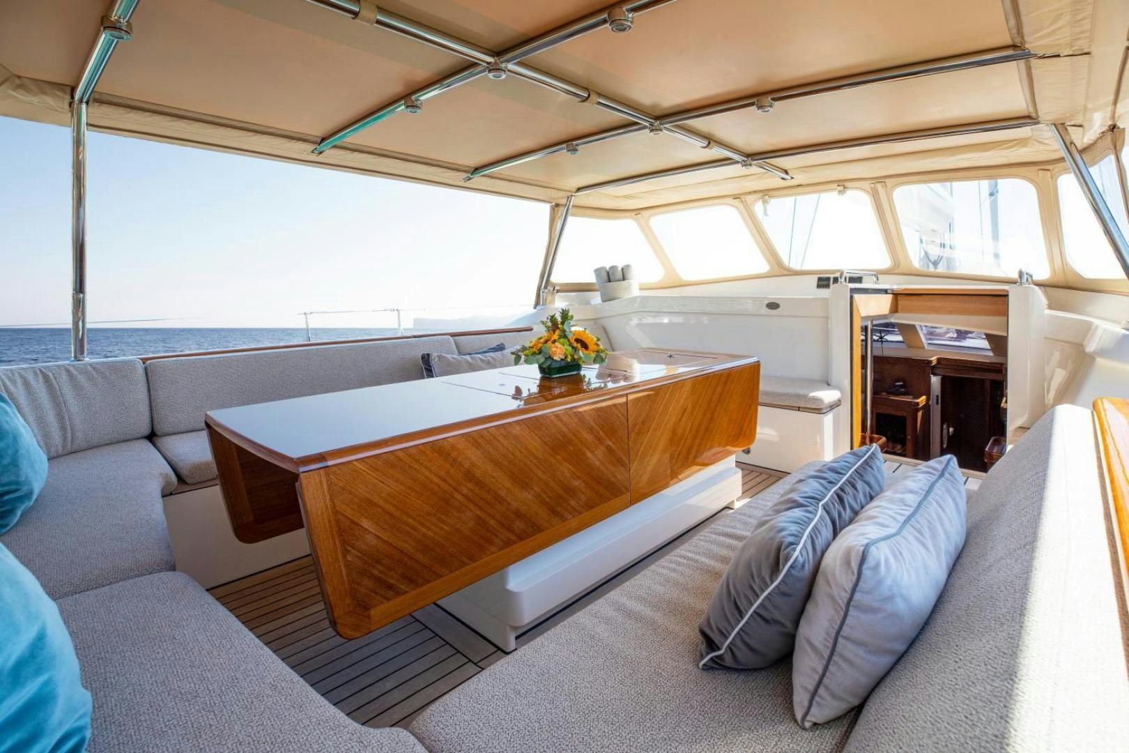 a large room with a couch and a table aboard WAVELENGTH Yacht for Sale