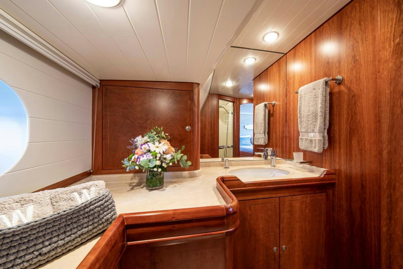 a bathroom with a sink and a mirror aboard WAVELENGTH Yacht for Sale