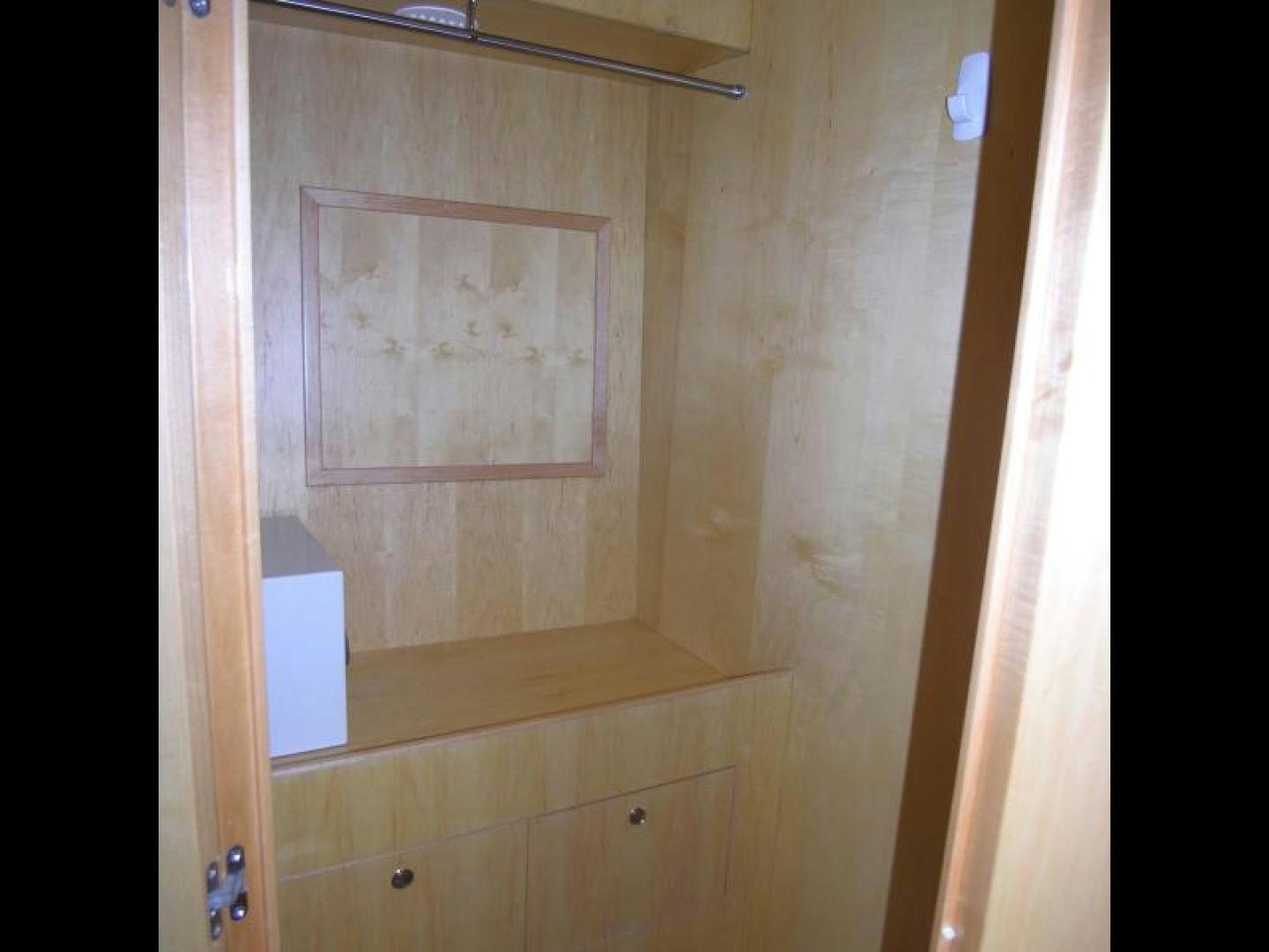 a white wall with a picture on it aboard BALOZI Yacht for Sale