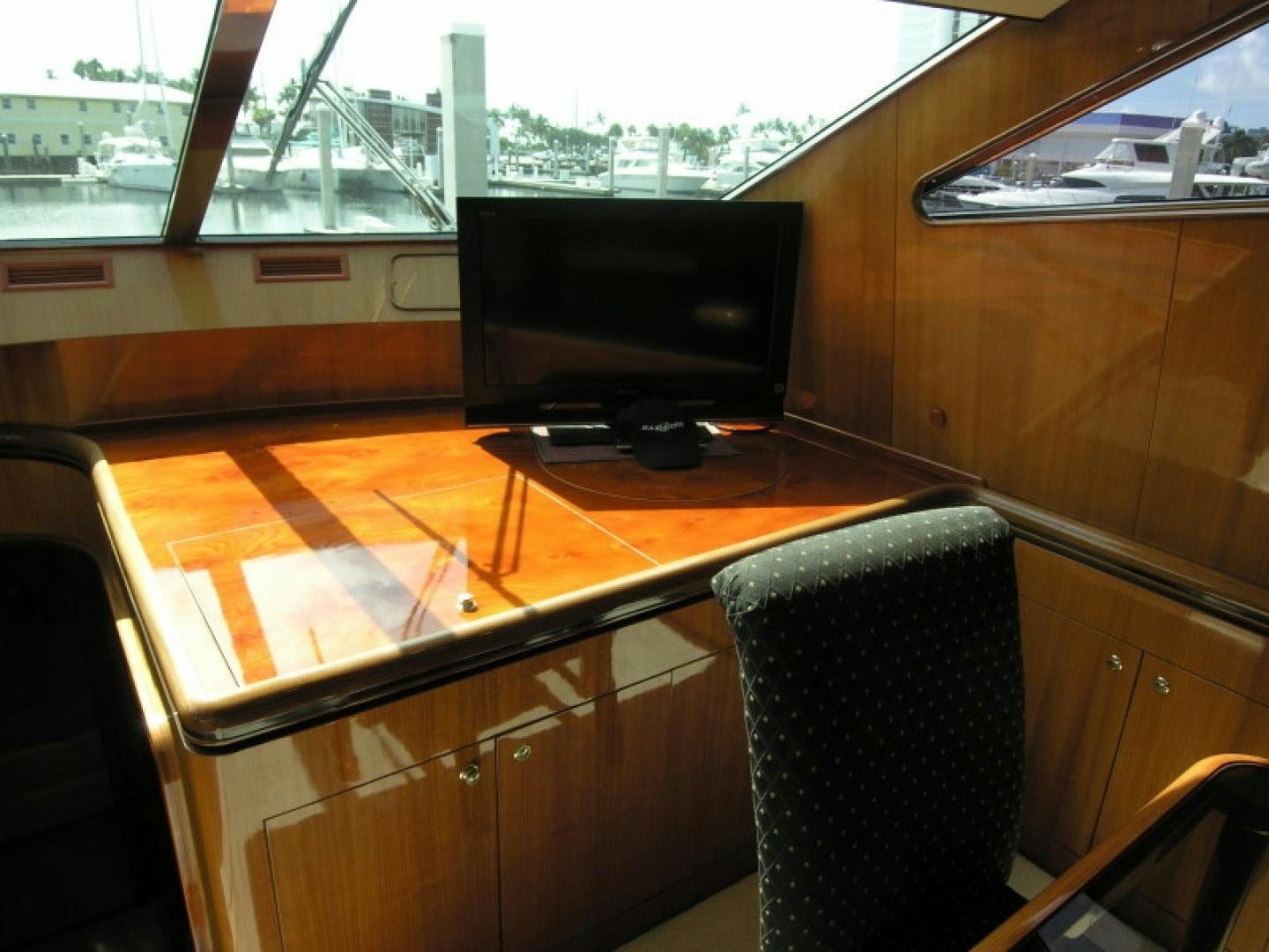 a room with a tv and a chair aboard BALOZI Yacht for Sale