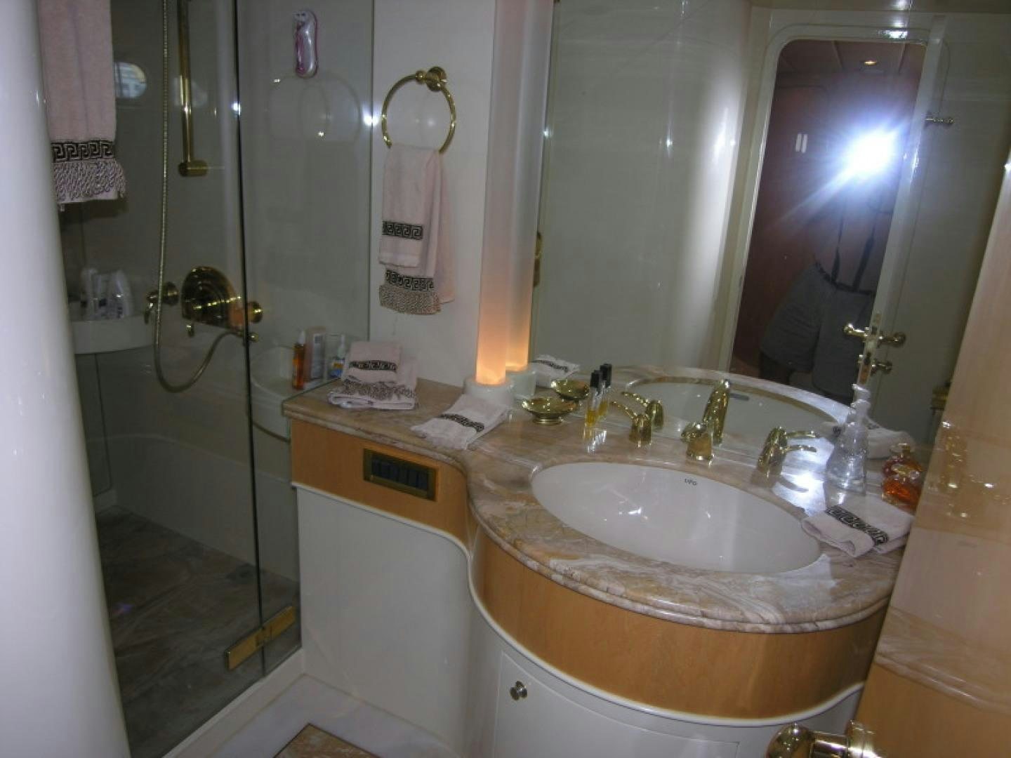 a bathroom with a sink and a mirror aboard BALOZI Yacht for Sale