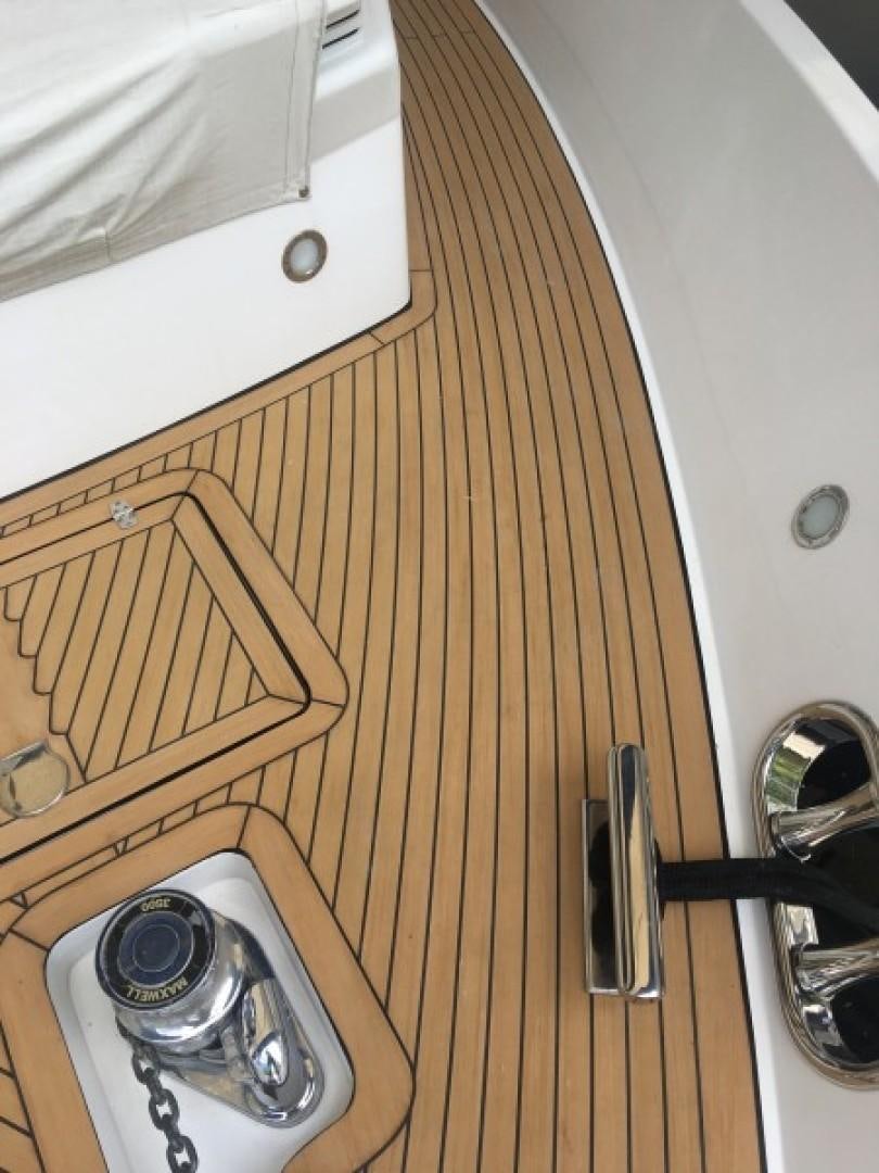 a wooden floor with a speaker and a white cabinet aboard BALOZI Yacht for Sale