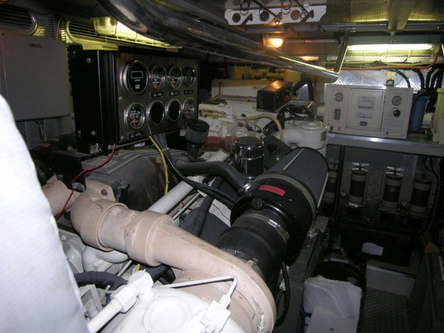 a person working on a machine aboard BALOZI Yacht for Sale