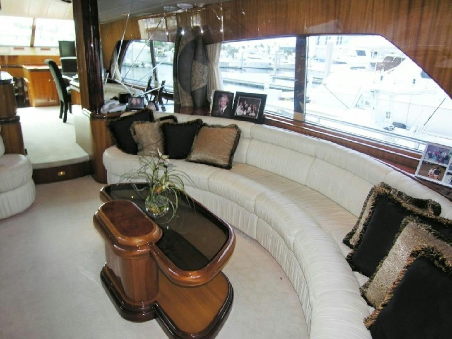 a living room with a couch and a coffee table aboard BALOZI Yacht for Sale