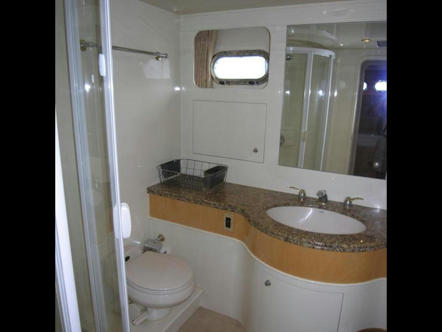 a bathroom with a sink and a toilet aboard BALOZI Yacht for Sale