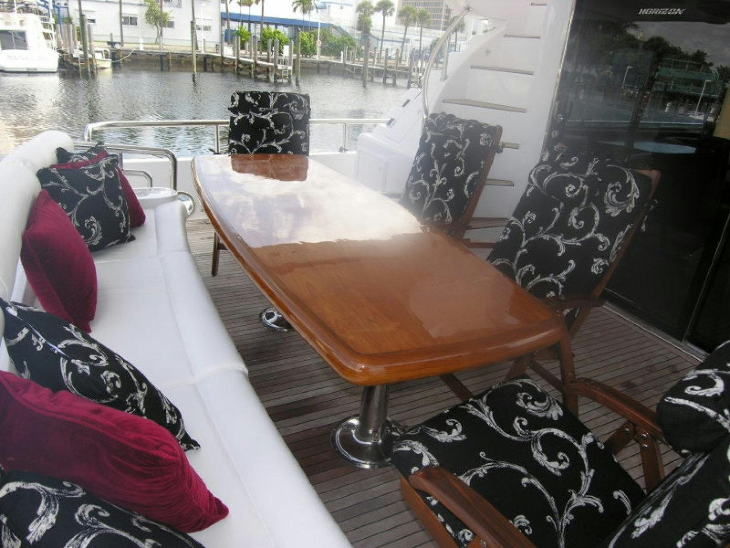 a table and chairs on a boat aboard BALOZI Yacht for Sale
