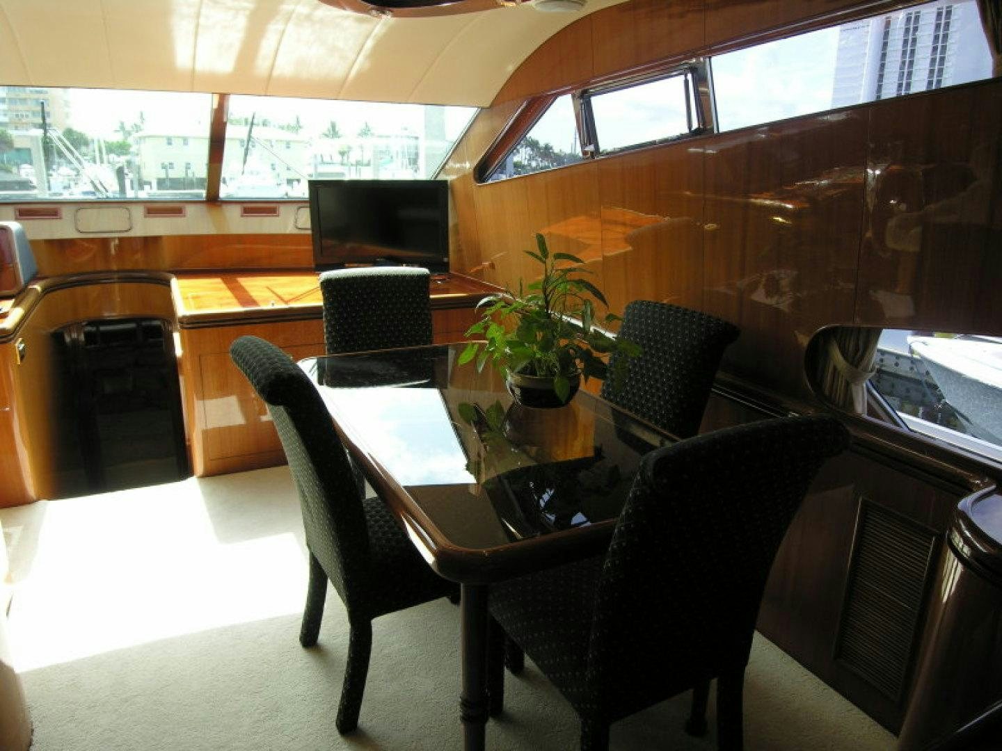 a room with a table and chairs aboard BALOZI Yacht for Sale