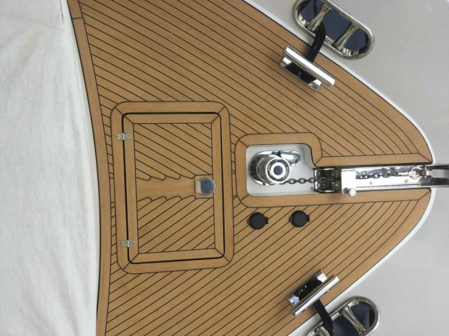 a wooden cabinet with a silver door and a silver door aboard BALOZI Yacht for Sale