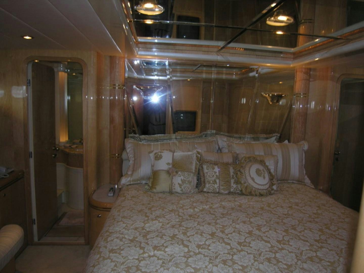 a bed in a room aboard BALOZI Yacht for Sale