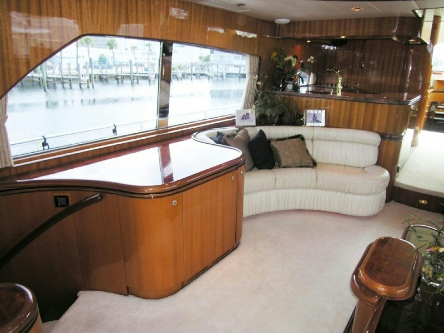 a room with a couch and a piano aboard BALOZI Yacht for Sale