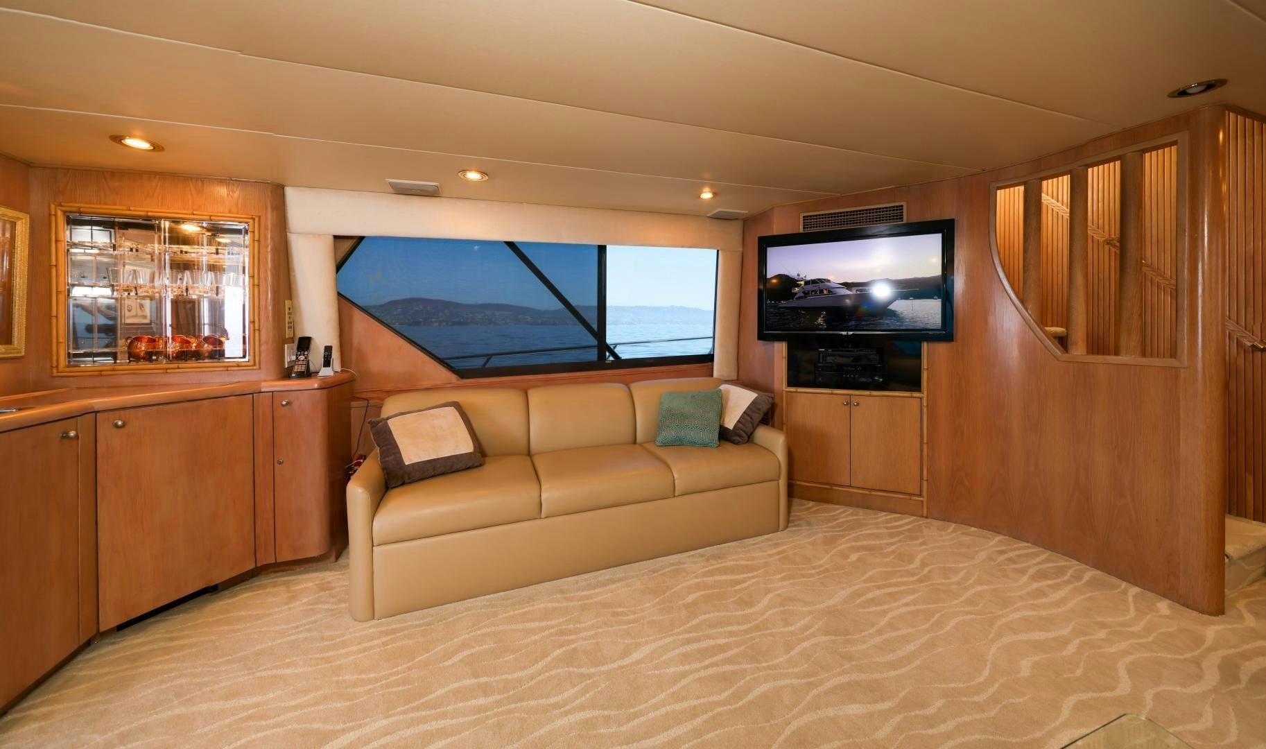 a living room with a large bed aboard FELINA Yacht for Sale