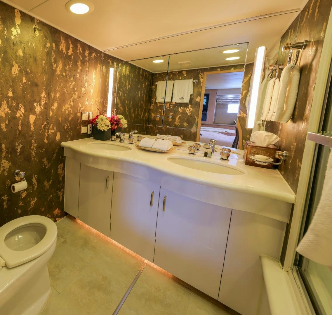 a bathroom with a large mirror aboard FELINA Yacht for Sale