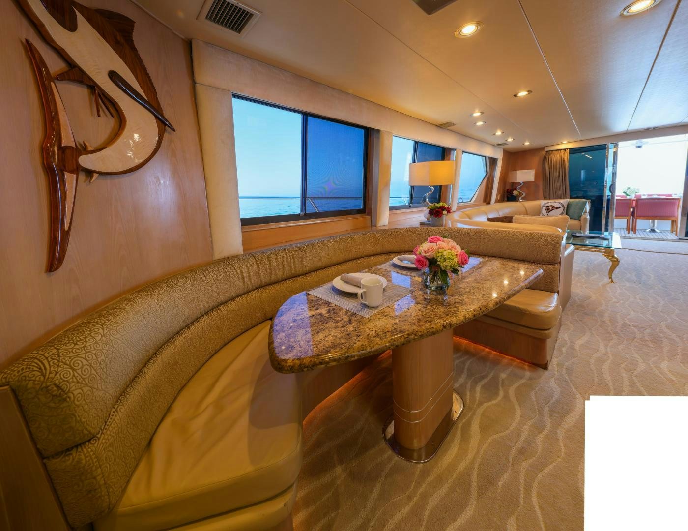 a living room with a couch and a coffee table aboard FELINA Yacht for Sale