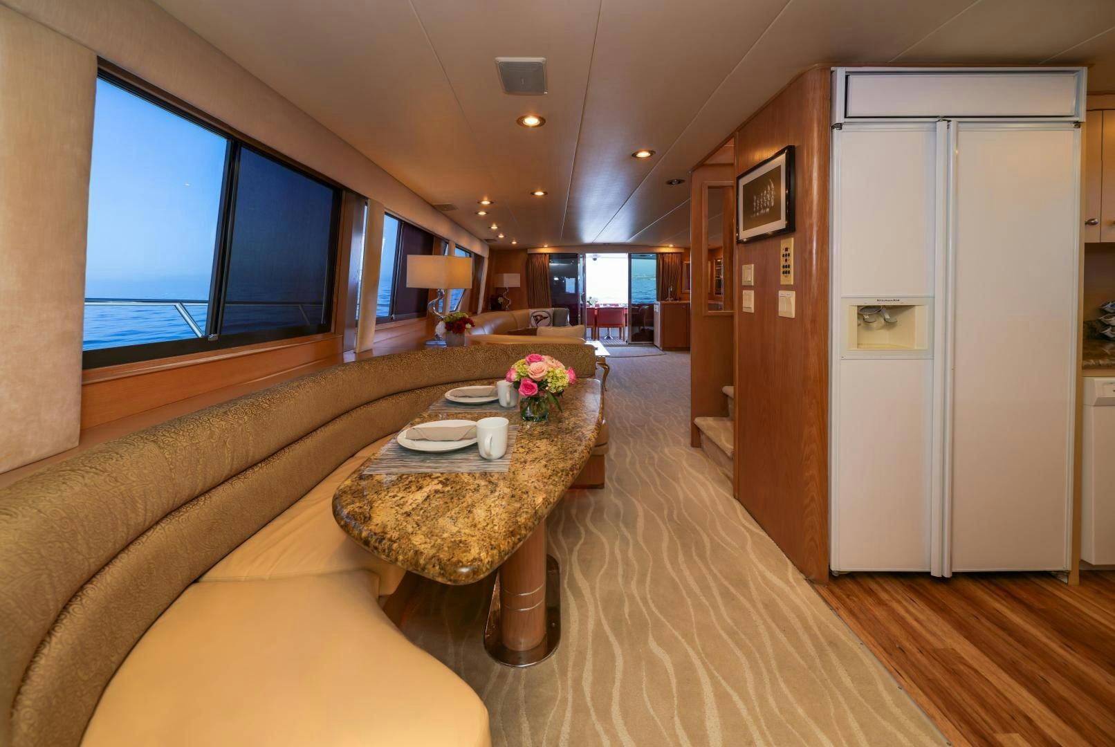 a living room with a large screen aboard FELINA Yacht for Sale