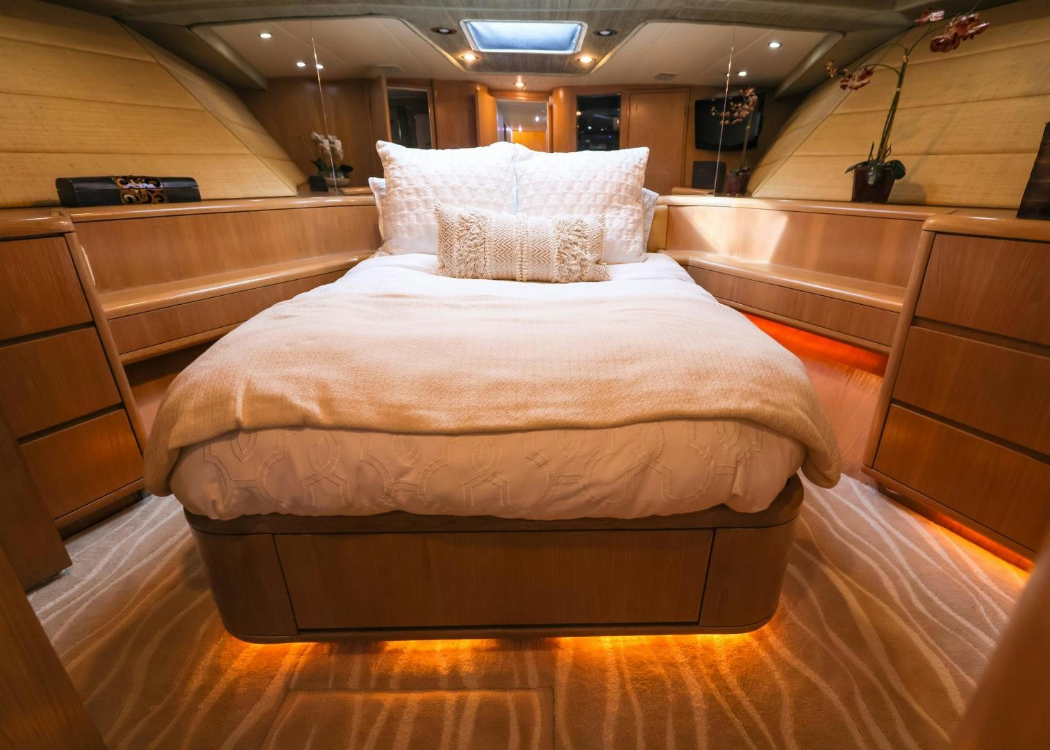 a bed with white sheets aboard FELINA Yacht for Sale