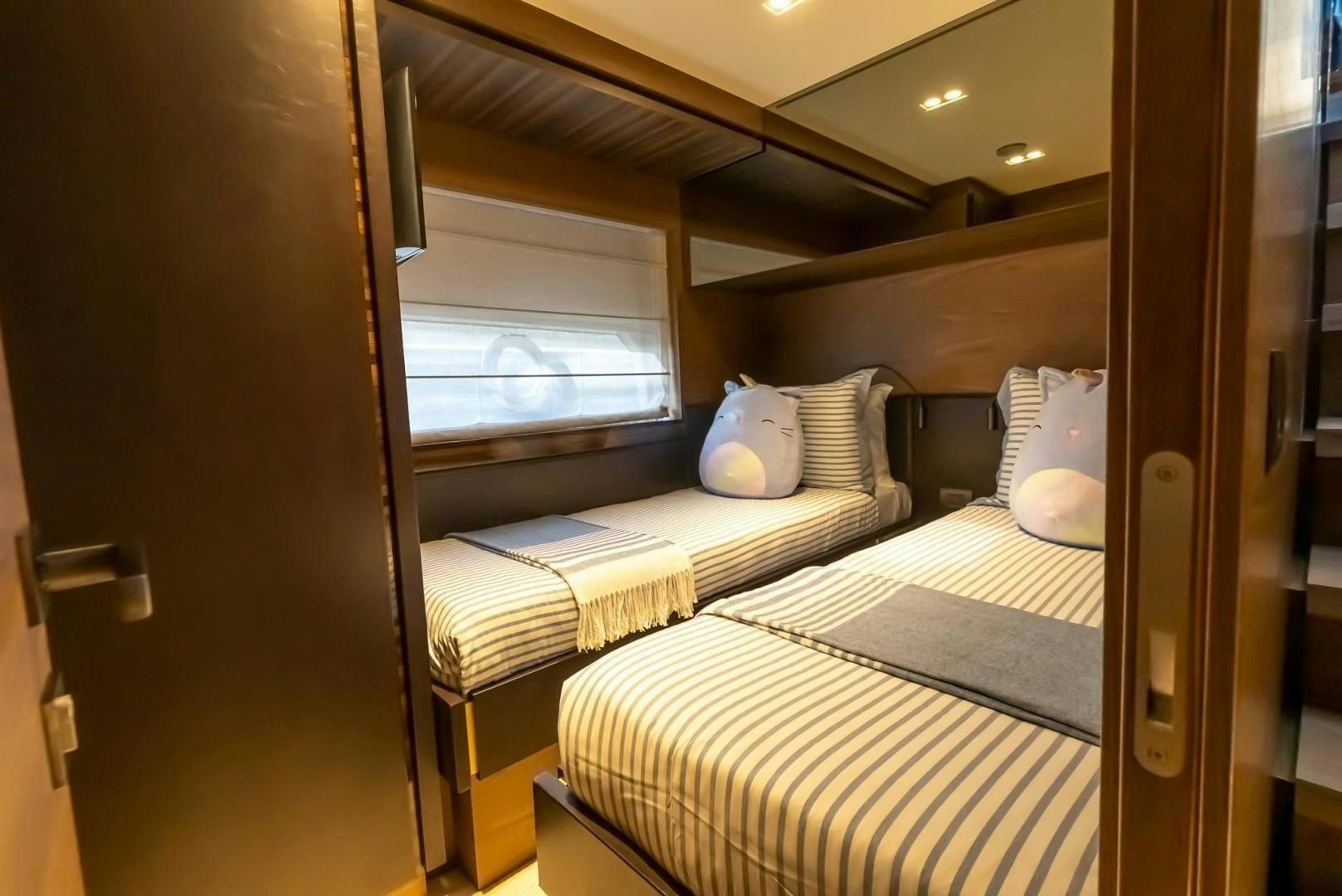 a room with two beds aboard LEGEND Yacht for Sale