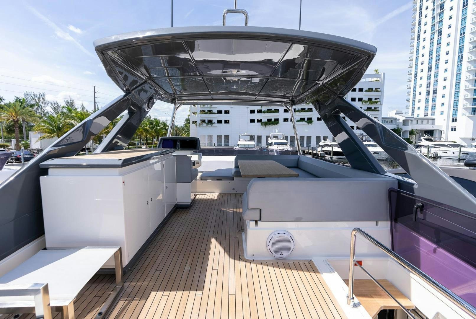 a deck with a large building in the background aboard LEGEND Yacht for Sale