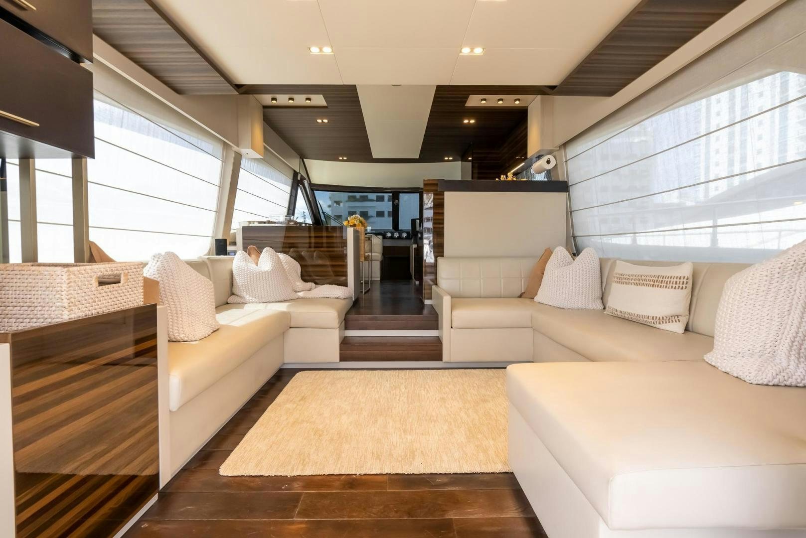 a living room with a large window aboard LEGEND Yacht for Sale