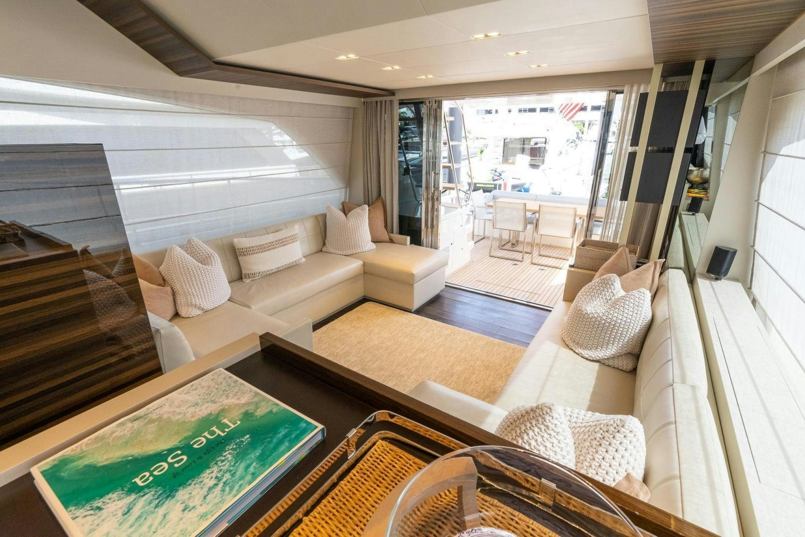 a living room with a large window aboard LEGEND Yacht for Sale
