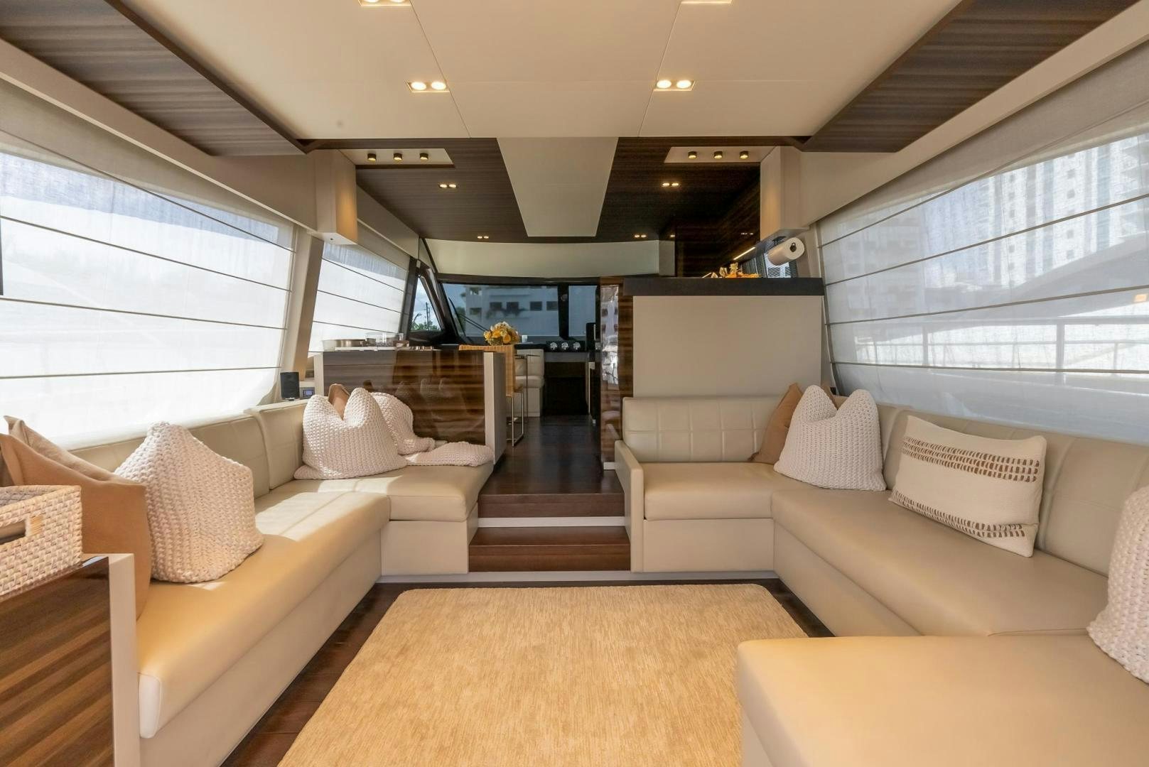 a living room with couches aboard LEGEND Yacht for Sale