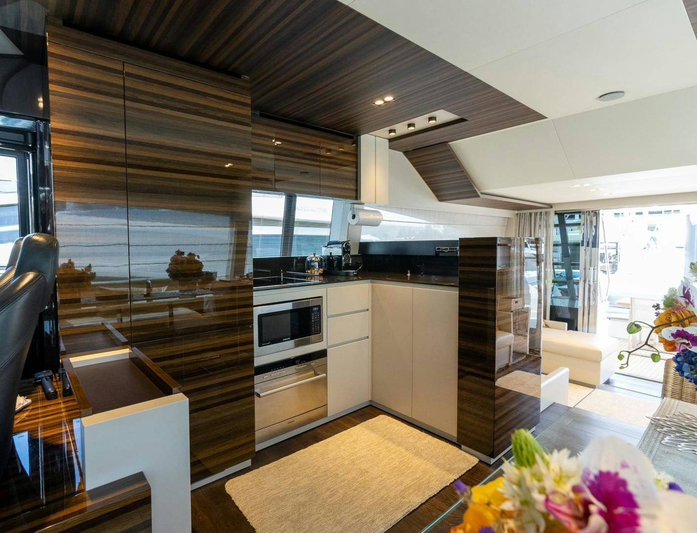 a kitchen with a glass wall aboard LEGEND Yacht for Sale