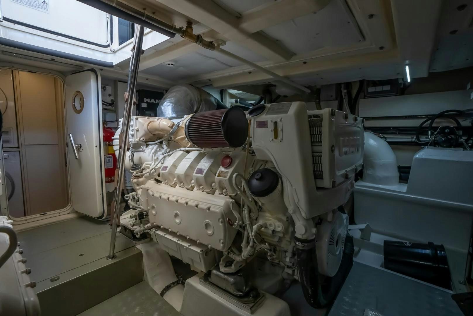 a large white machine in a room aboard LEGEND Yacht for Sale