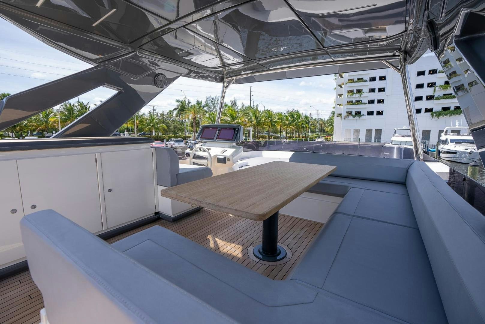 a table on a deck aboard LEGEND Yacht for Sale