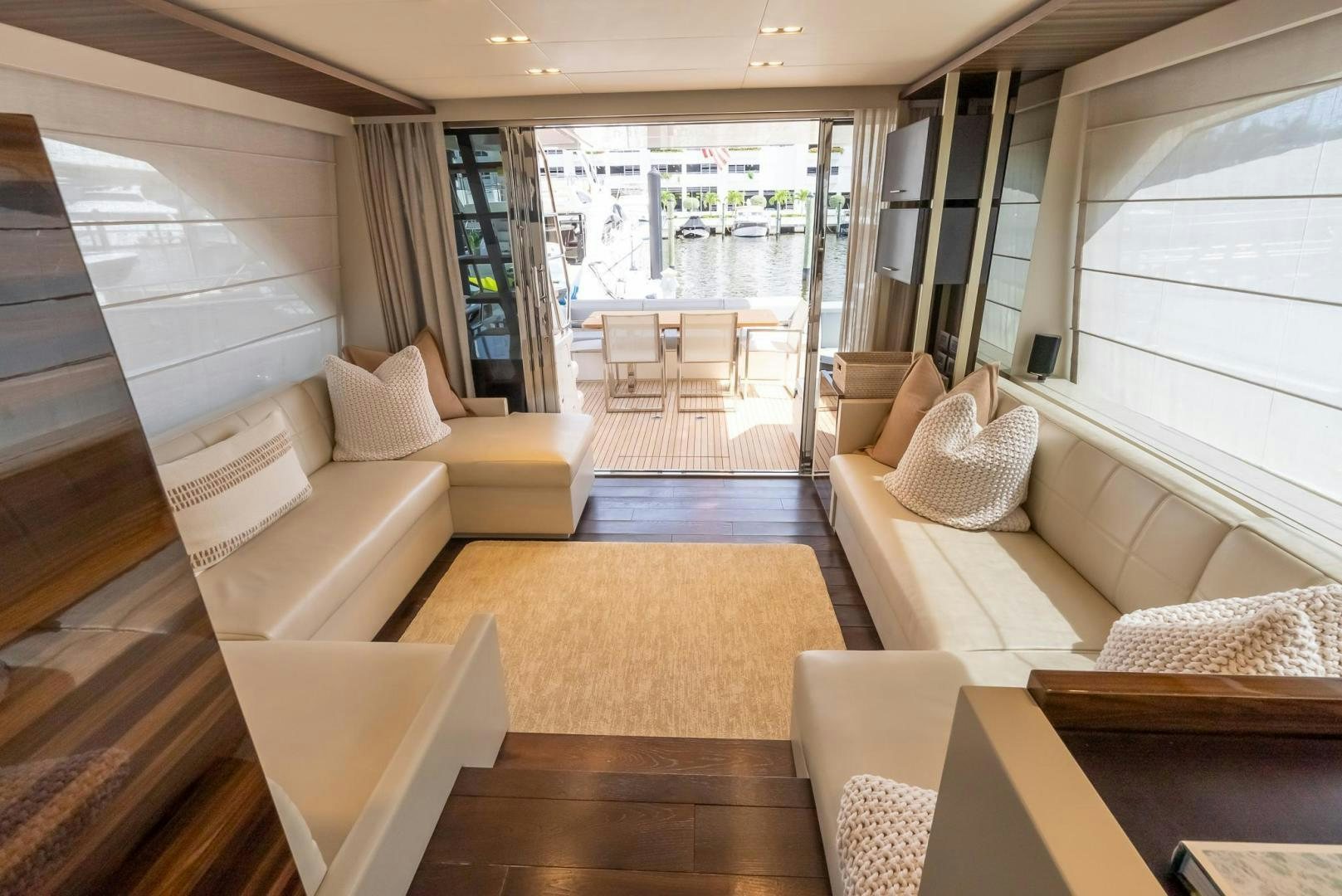a living room with a large window aboard LEGEND Yacht for Sale