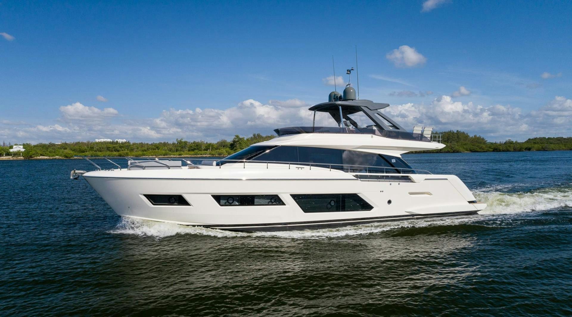 a white yacht on the water aboard LEGEND Yacht for Sale