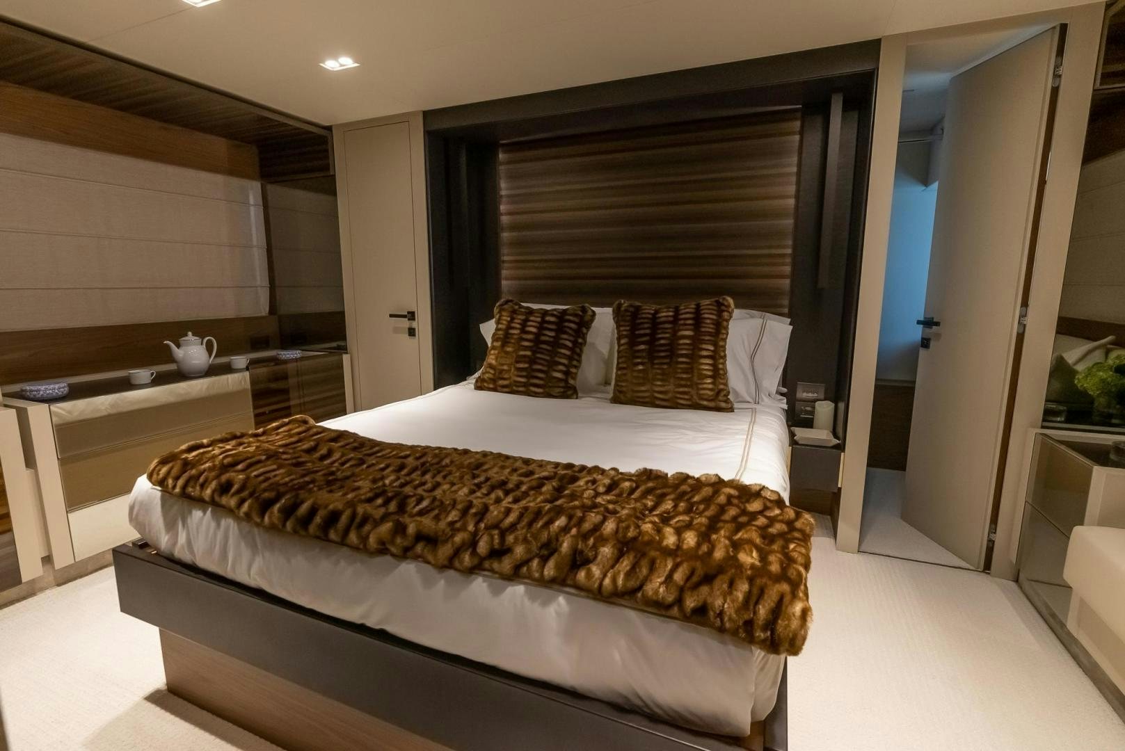 a large bed in a room aboard LEGEND Yacht for Sale