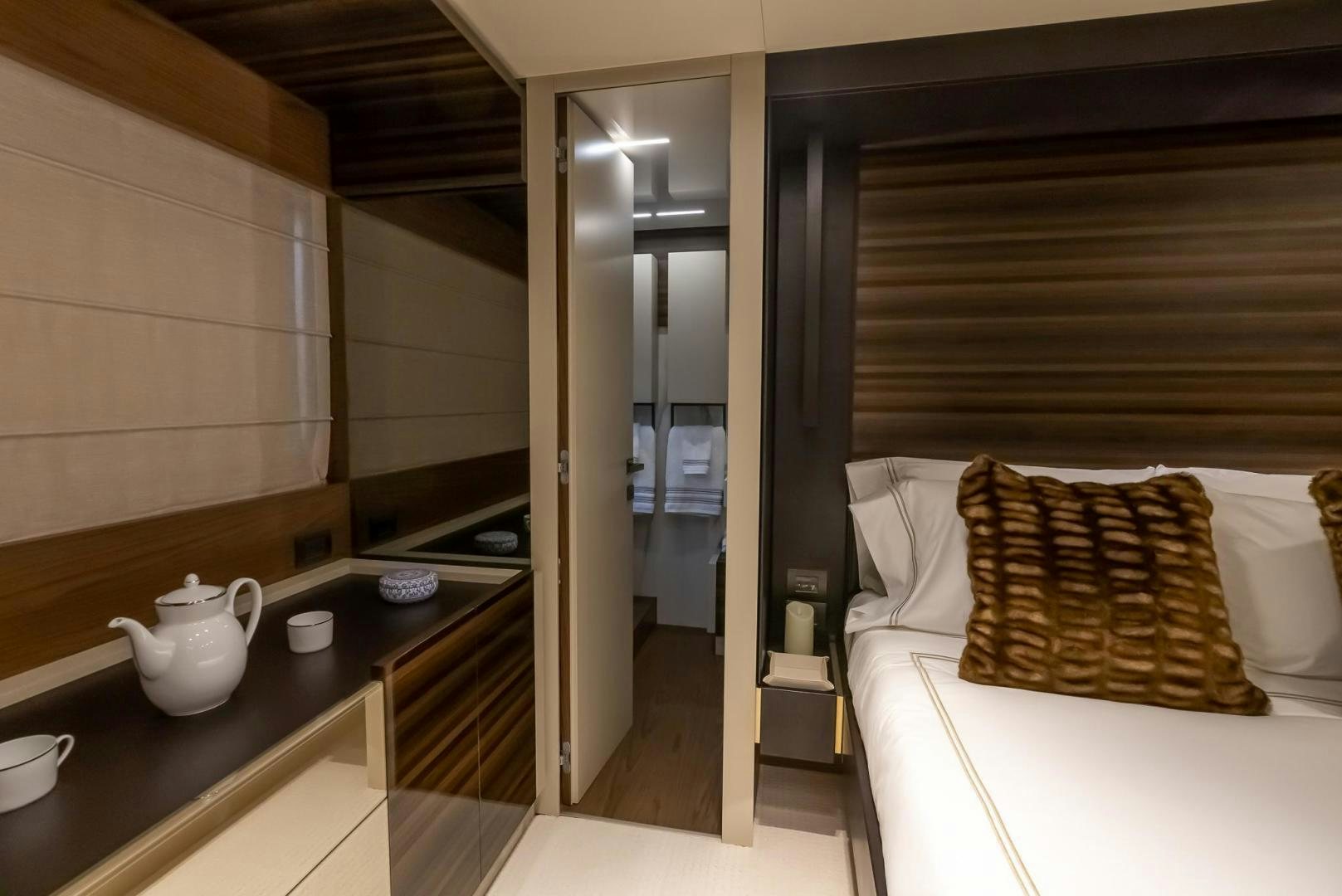 a room with a bed and a sink aboard LEGEND Yacht for Sale