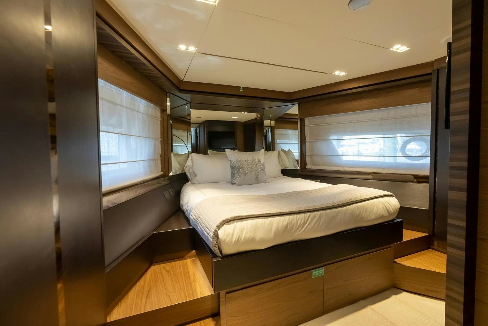 a bed in a room aboard LEGEND Yacht for Sale