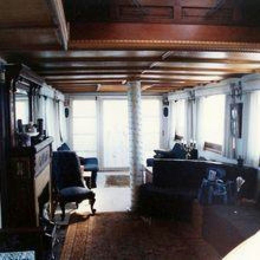 a room with a desk and chairs aboard EL PRIMERO Yacht for Sale