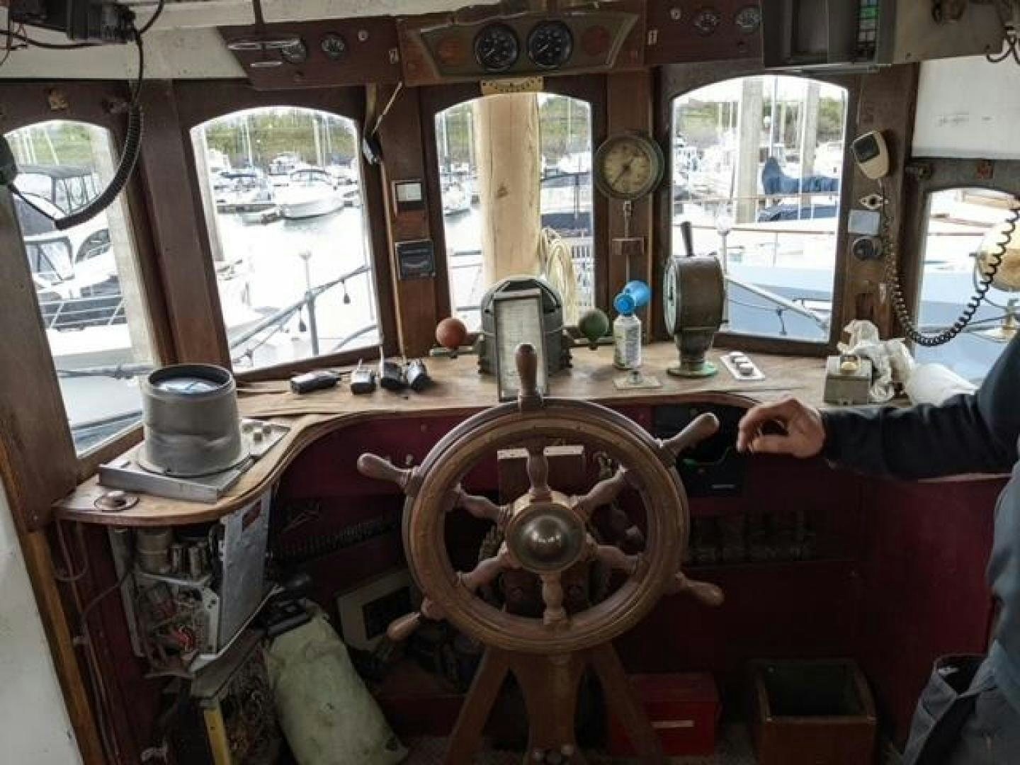 a boat with a steering wheel aboard EL PRIMERO Yacht for Sale