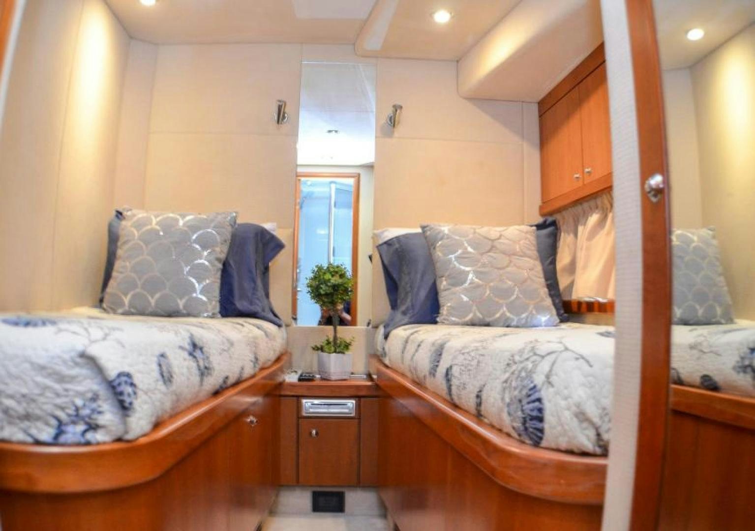 a bedroom with two beds aboard PEARL Yacht for Sale