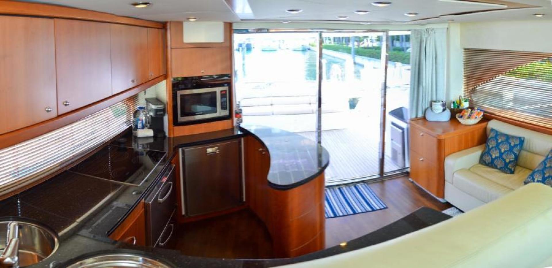 a kitchen with a sliding glass door aboard PEARL Yacht for Sale