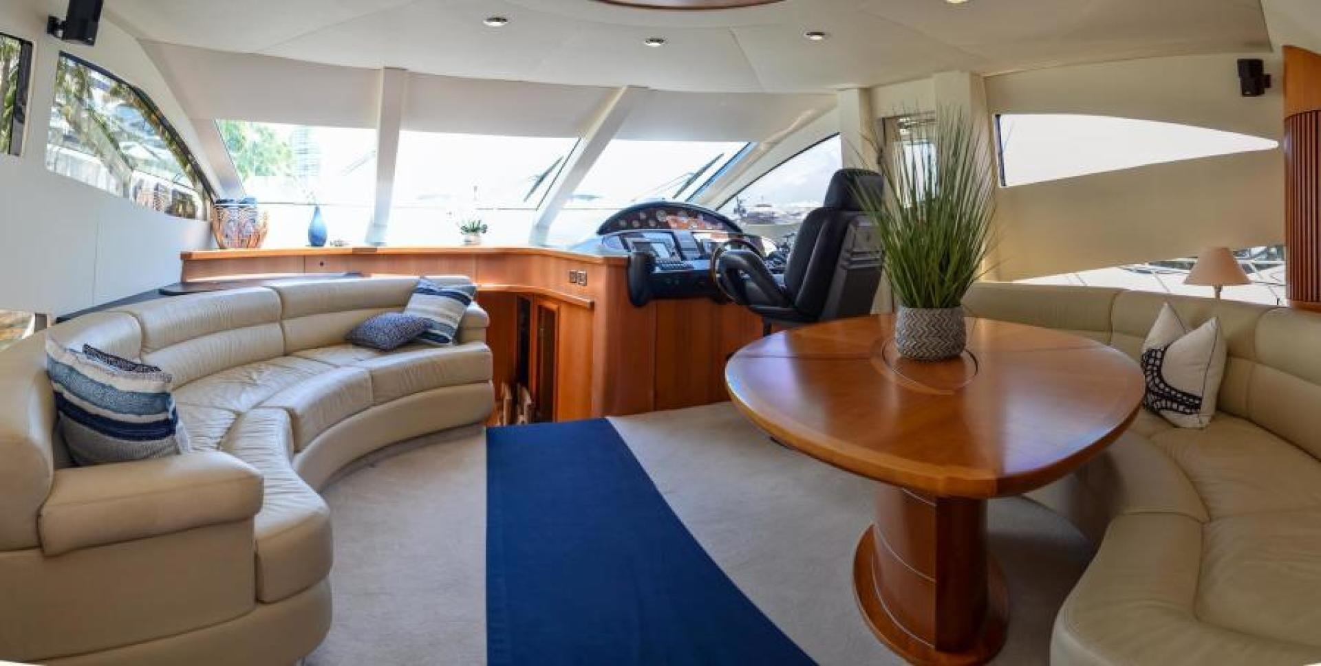 a living room with a couch and a table aboard PEARL Yacht for Sale