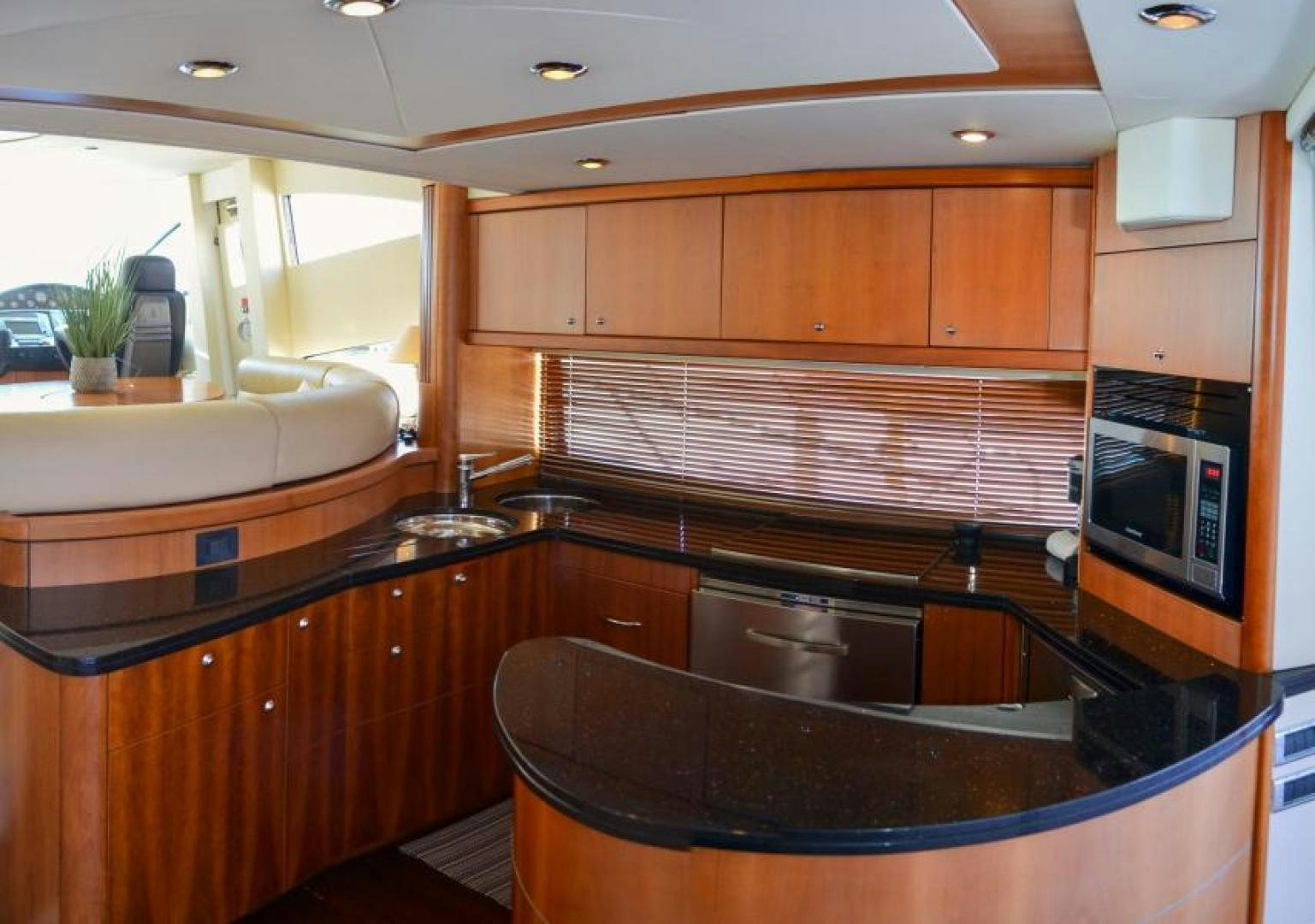 a kitchen with wooden cabinets aboard PEARL Yacht for Sale