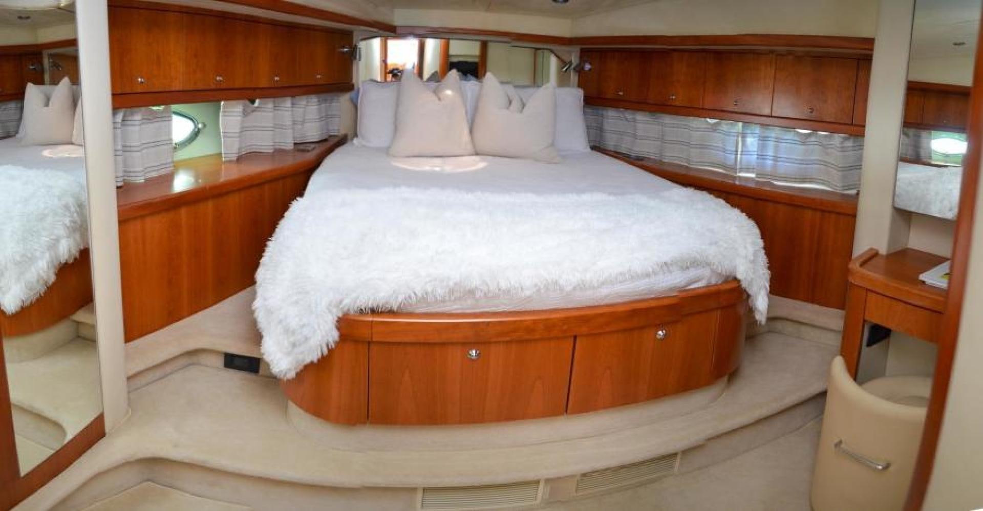 a bed with white sheets aboard PEARL Yacht for Sale